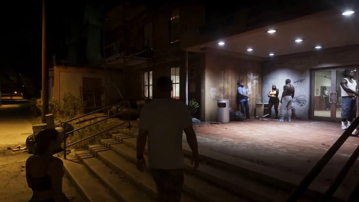 GTA 6 gameplay showing vehicles driving in downtown Vice City under neon light.